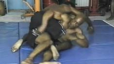 Black wrestlers get done grappling and go down on a hard bone