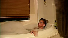 Amanda takes a soothing and relaxing bubble bath and plays with her hungry pussy